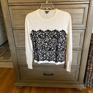 Soft cream light weight sweater top with a black lace insert
